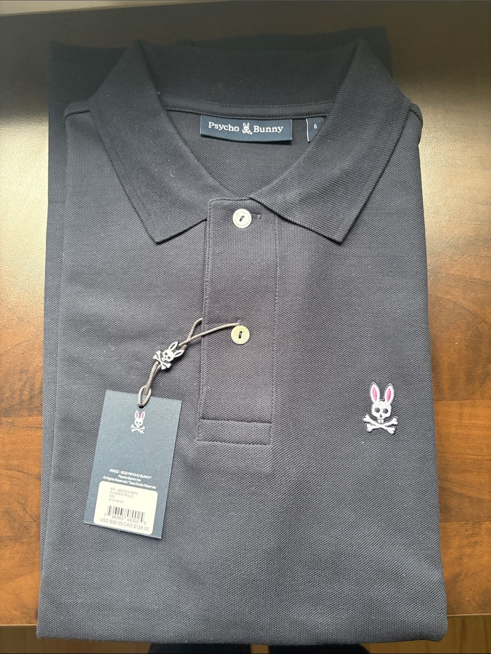 Psycho Bunny Navy Polo with Pink-Accented Bunny Logo